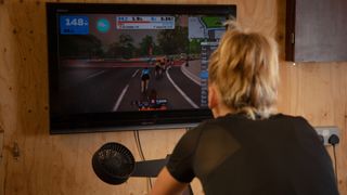 back of a rider's head as they cycle on Zwift